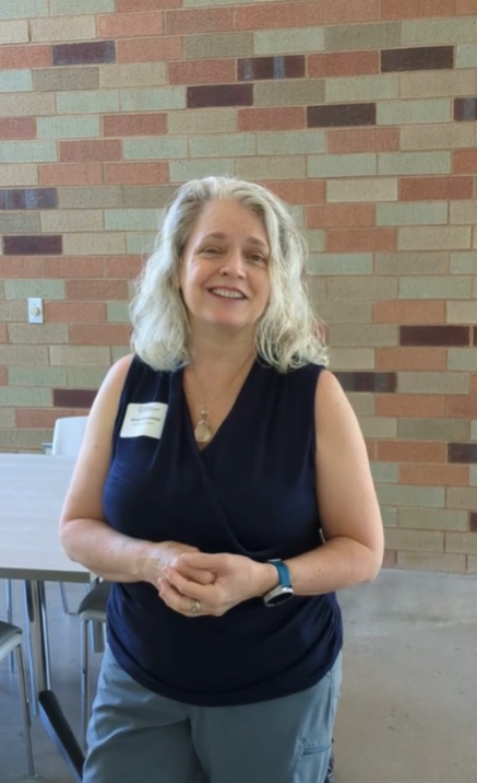 Anne O'Conner at SBC in front of brick wall