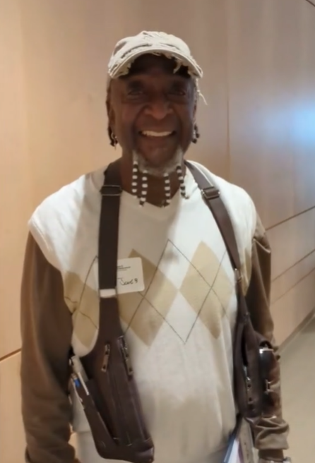 attendee smiles in hallway